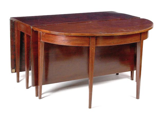 A Regency mahogany demi-lune dining table