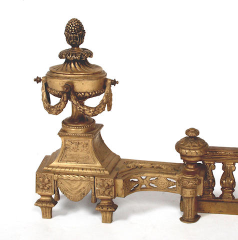 A pair of French 18th Century style gilt bronze chenets and kerb