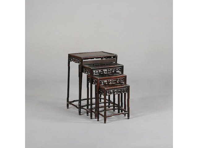 A 20th Century nest of four bois satin&#233; Chinese tables, 51cm wide x 37cm deep x 72cm high.