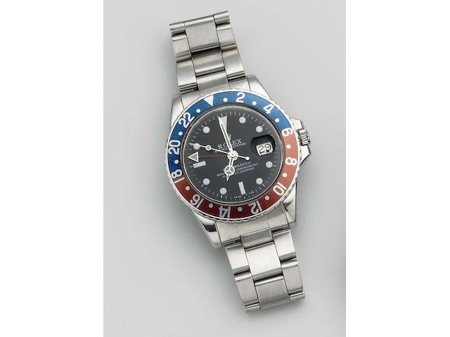 Rolex. A stainless steel automatic calendar bracelet watch with 24-hour hand and together with Rolex box and papers GMT Master, No.1330812, Sold on the 31st December 1966