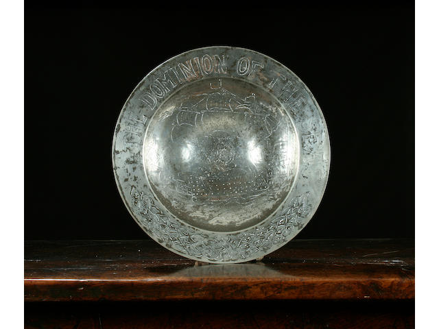 An important engraved bossed dish, circa 1640