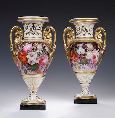 A pair of two handled white and gilt vases, possibly Coalport Circa 1815 - 1820
