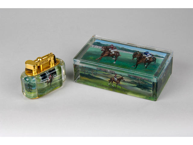A Dunhill perspex and brass lighter and ensuite perspex cigarette box