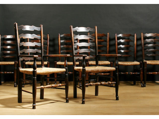 A harlequin set of twelve 19th Century ash ladderback dining chairs