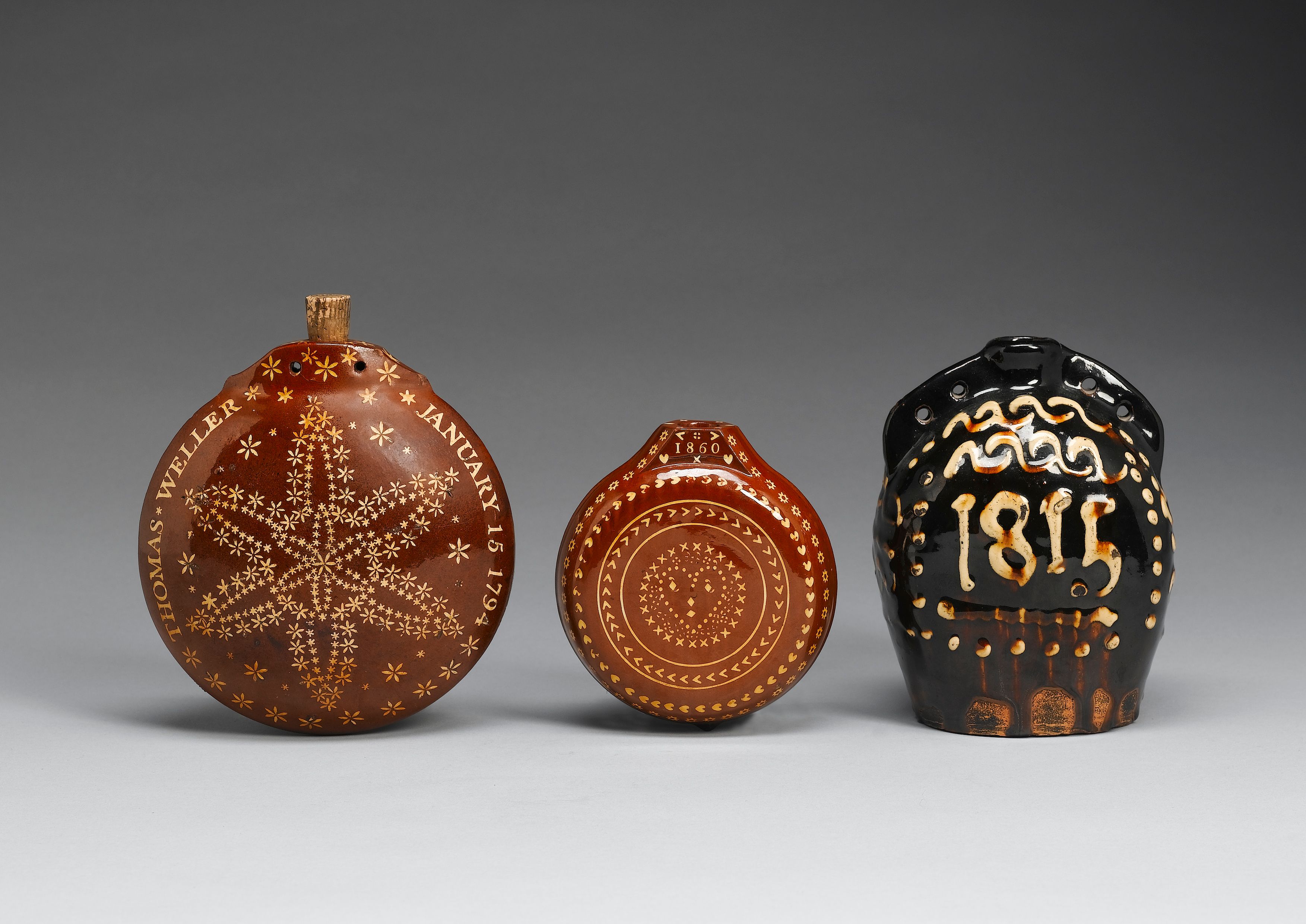 A dated slipware costrell dated 1815