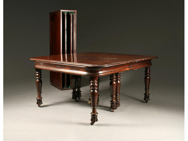 A large and impressive William IV/early Victorian mahogany draw-out extending dining table
