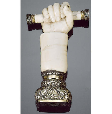 A Victorian ivory and silver-gilt mounted table seal in form of a hand,