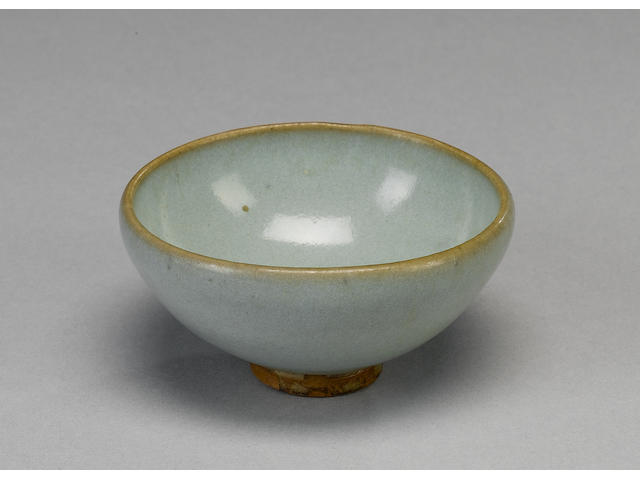 A small Junyao bowl with turquoise glaze and circular foot;