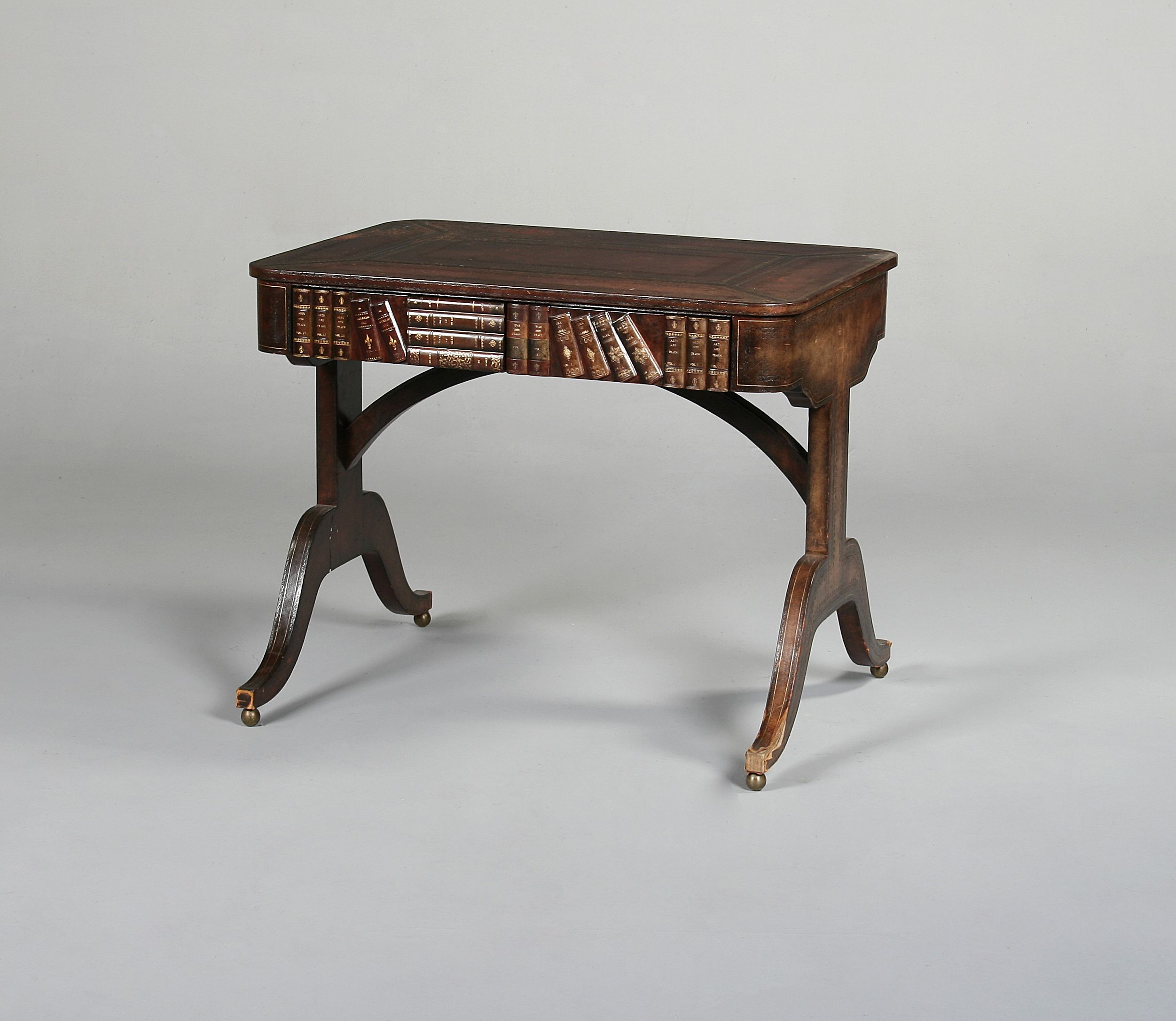 A Regency style leather clad library table