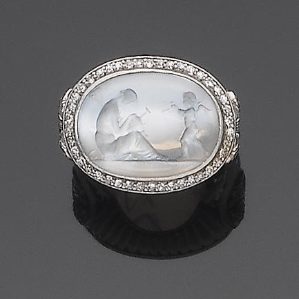 A early 20th century moonstone intaglio and diamond ring,