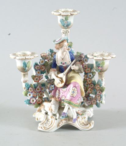 A pair of Continental porcelain figural candelabra