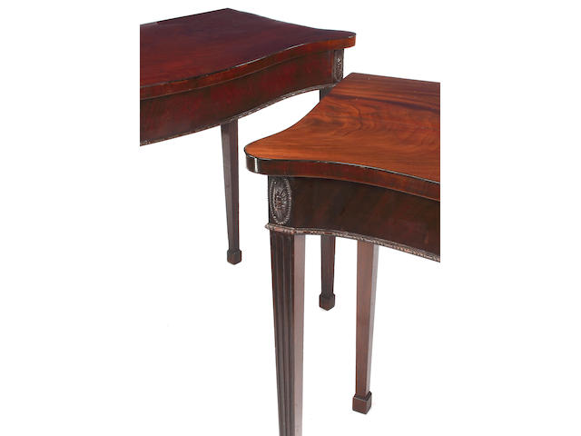A George III mahogany serpentine side table