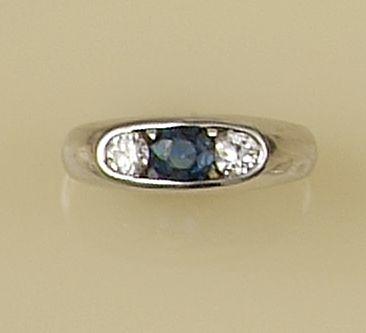 An 18ct white gold sapphire and diamond three stone ring,