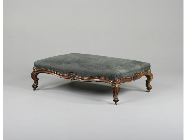 A large Victorian rosewood low stool