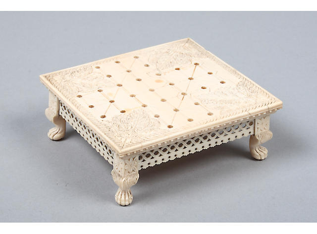 A late 19th Century carved ivory games board