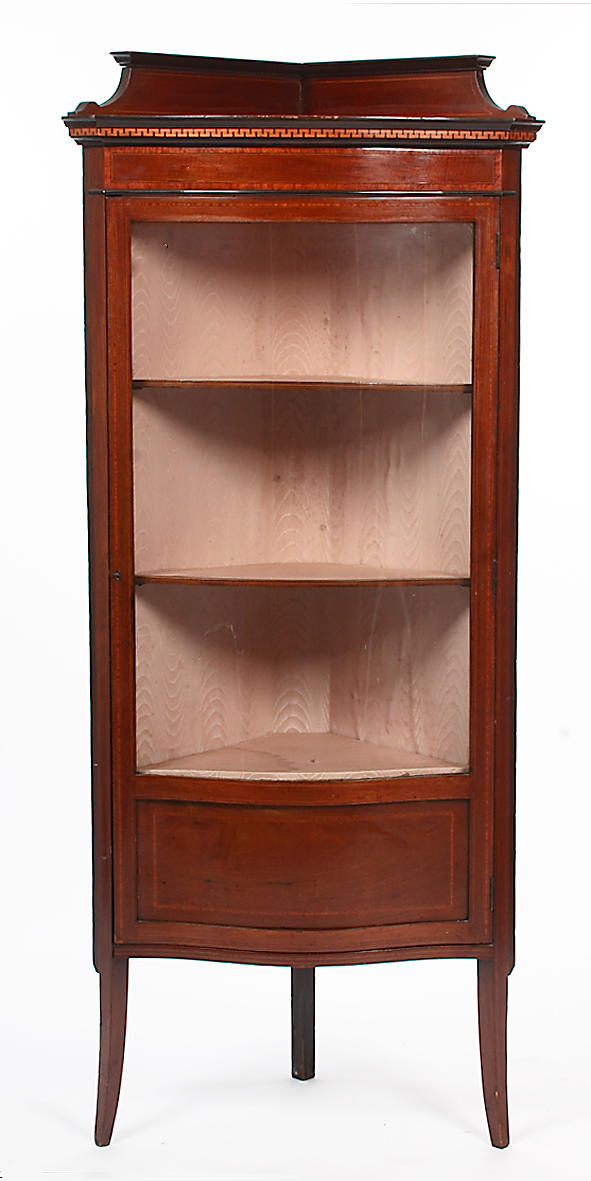 An Edwardian mahogany corner display cabinet