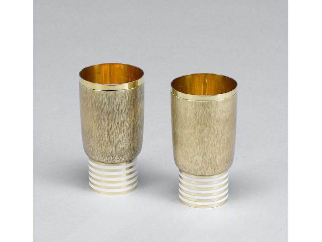 GERALD BENNEY : A pair of silver-gilt and enamelled beakers, London 1972,