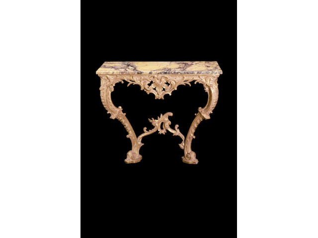 A George III carved giltwood console tablein the rococo taste