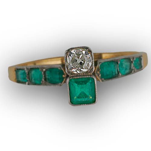 An emerald and diamond ring