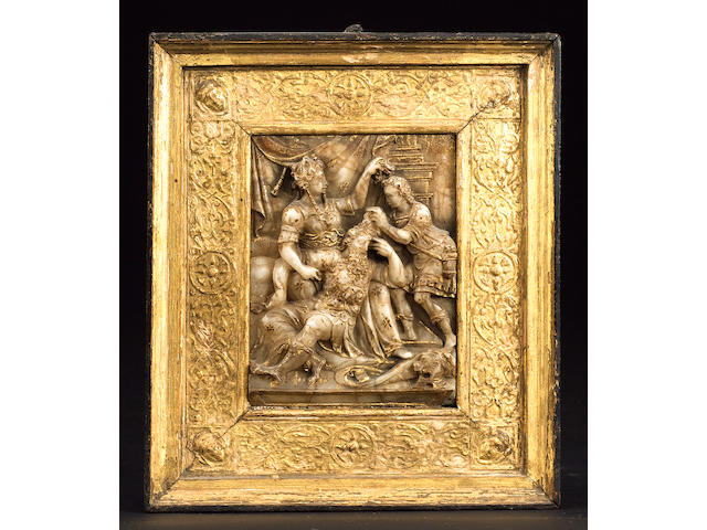 A 16th century Malines alabaster relief carved with Samson and Delilah
