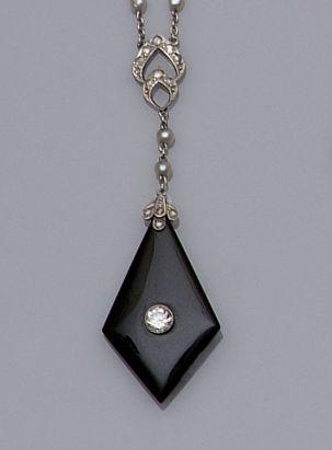 An early 20th century onyx diamond and freshwater seed pearl necklace