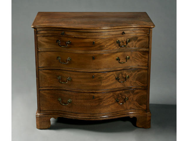 A George III mahogany serpentine chest