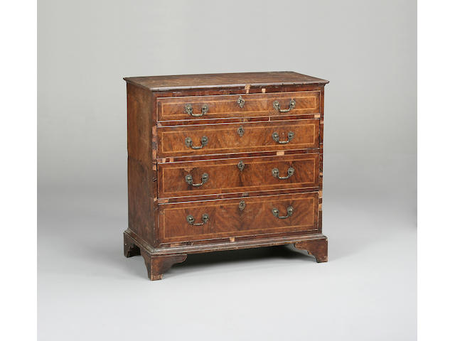 A walnut and yew wood chest of drawers