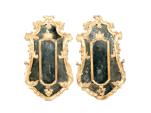 A pair of mid 18th century Italian carved giltwood mirrors,