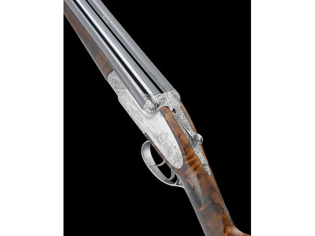 A fine K. Thomas-engraved 12-bore (2&#190;in) self-opening sidelock ejector gun by Asprey, no. 2027 In its brass-mounted leather case (with accessories)