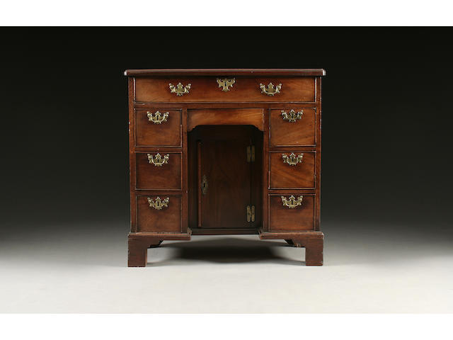 An early George III mahogany kneehole desk of small proportions