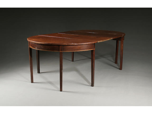 An early 19th Century mahogany D-end dining table