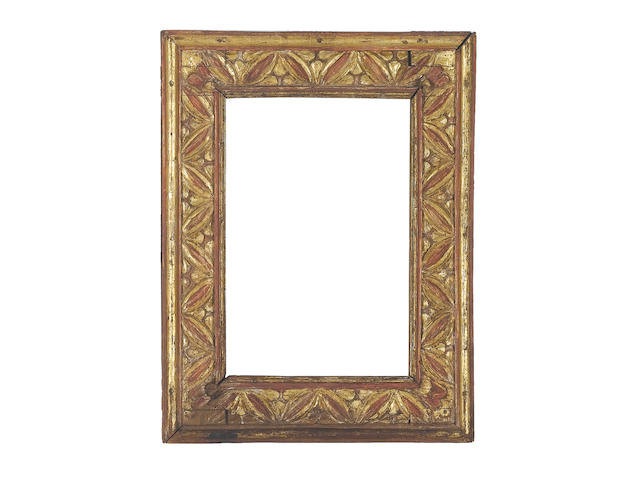 An Italian 17th Century carved, parcel-gilt and red painted cassetta frame