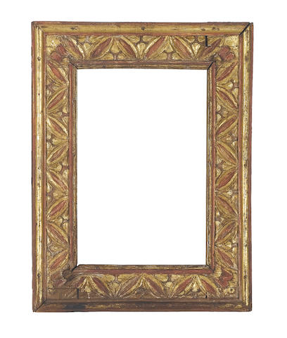 An Italian 17th Century carved, parcel-gilt and red painted cassetta frame