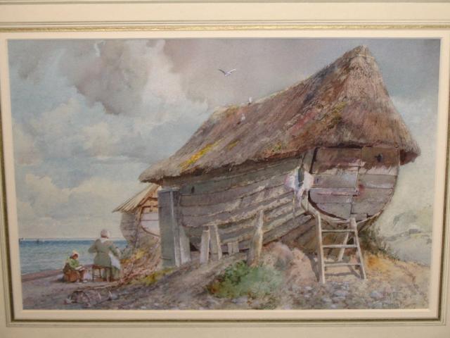 Ben John Merrifield Donne (British 1831-1928) 'Etratat Normandy', a coastal scene, figures seated beside beached vessels converted into dwellings with thatched roofs, signed and inscribed, watercolour, 22.9cm x 34.1cm.