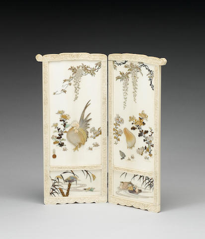 An elegant ivory two-leaf screen;