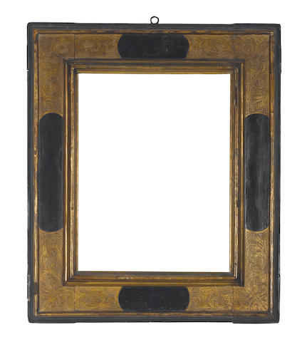 A Spanish 17th Century parcel-gilt and black painted cassetta frame