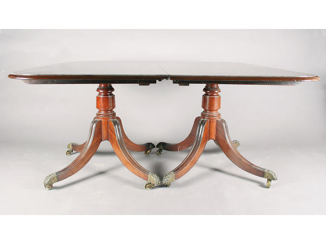 An early 19th century mahogany twin pedestal dining table