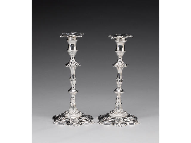A matched pair of George III cast silver candlesticks, by William Cafe, London 1763 / 1765,