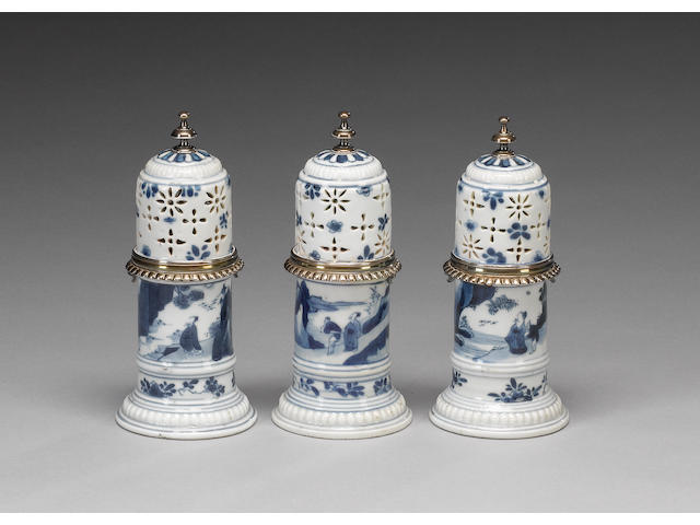 An elegant trio of blue and white sugar sifters;