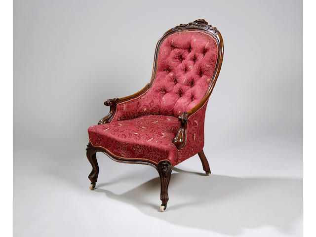 An early Victorian walnut framed armchair