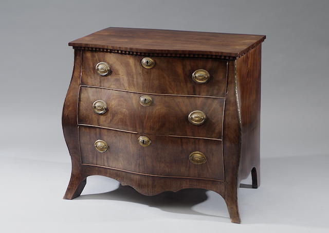 A late 18th Century Dutch mahogany bombe commode With dentil frieze above three long drawers, on swept bracket feet, 95cm wide.