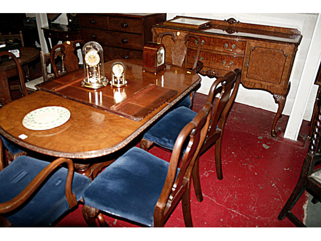 An early 20th Century burr walnut dining room suite