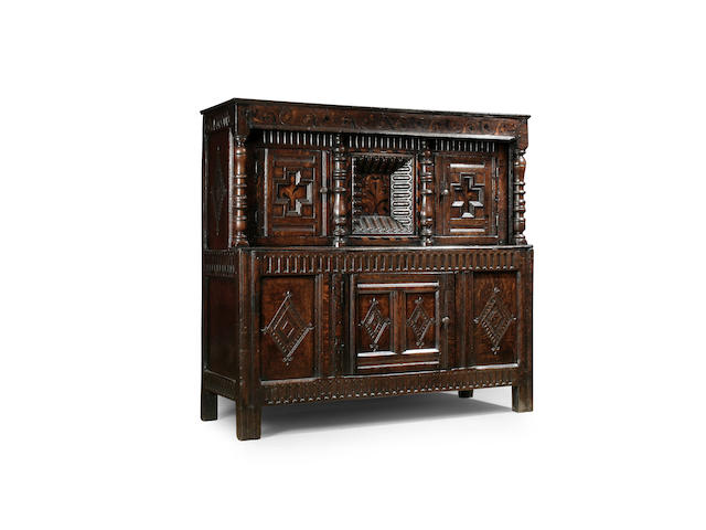 A mid 17th Century oak and inlaid court cupboard