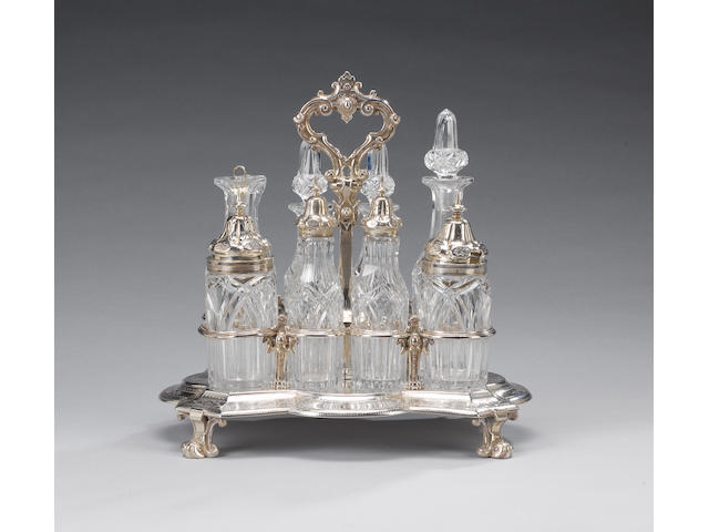 A Victorian silver cruet frame fitted with eight clear glass bottles, by Messrs Barnard & Sons, London 1871,