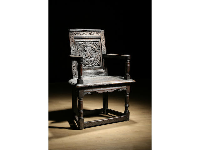 A late 16th/early 17th Century oak Anglo French 'caqueteuse' armchair
