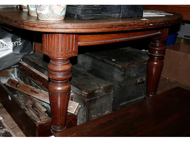 A Victorian walnut extending dining table,