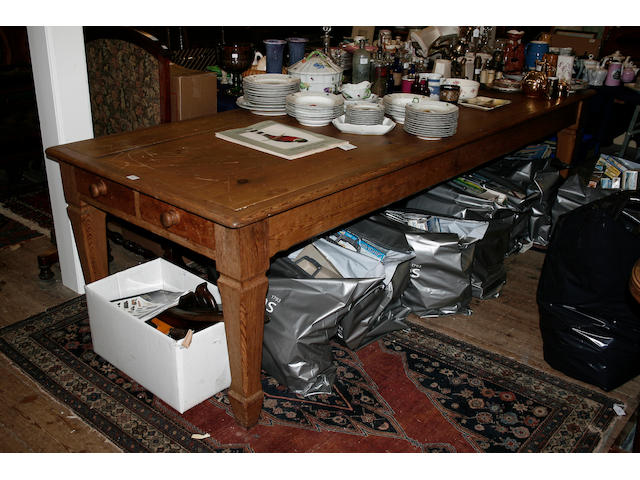 A large stripped pine "farmhouse" kitchen table,