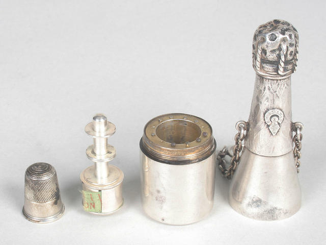 A good silver sewing compendium, scent bottle and vinaigrette, by Samuel Mordan & Co., in the form of champagne bottle