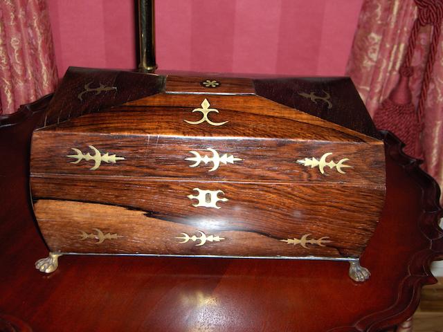 A late Regency rosewood and brass inlaid tea caddy
