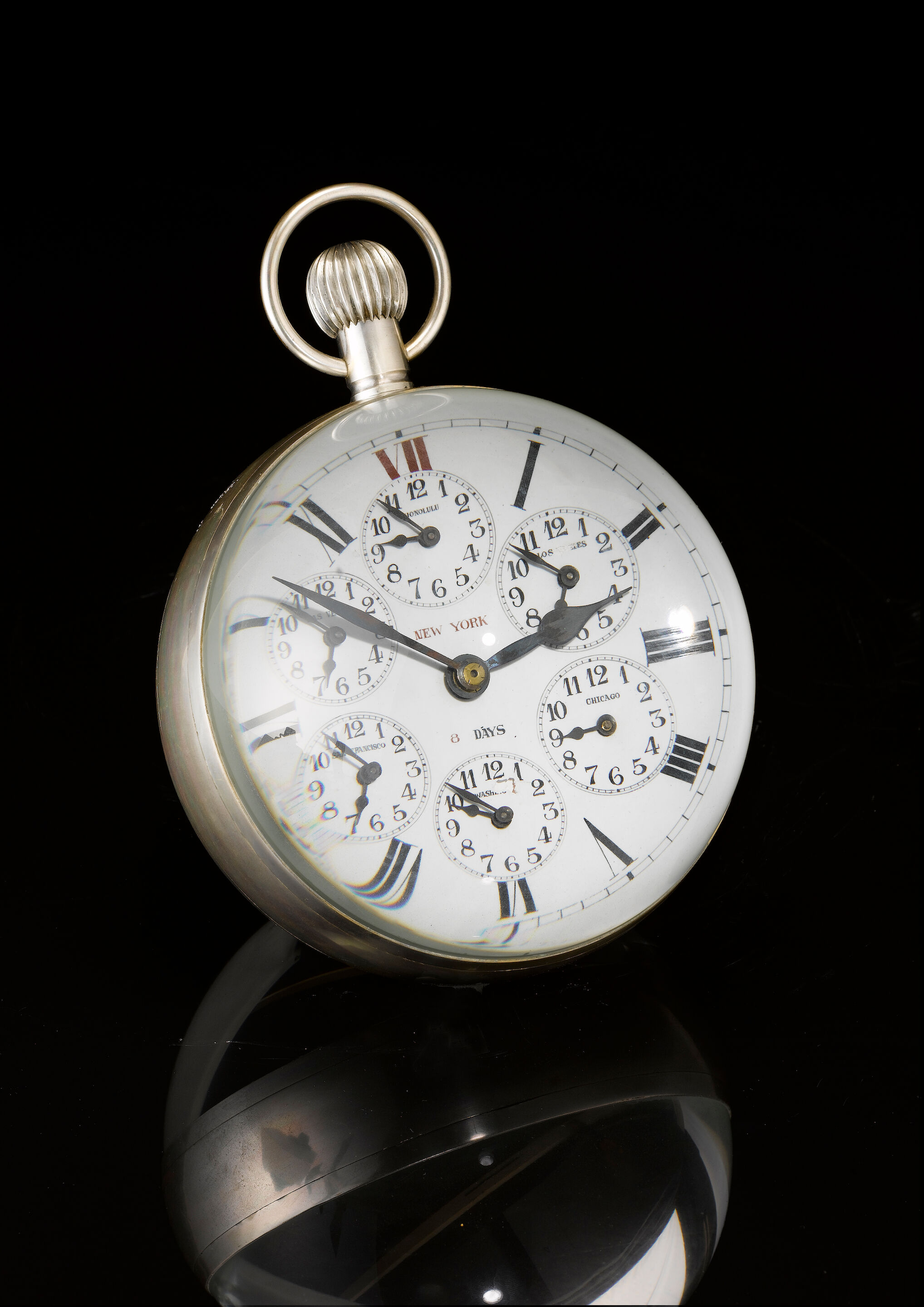 A large glass Bulls Eye timepiece Elgin